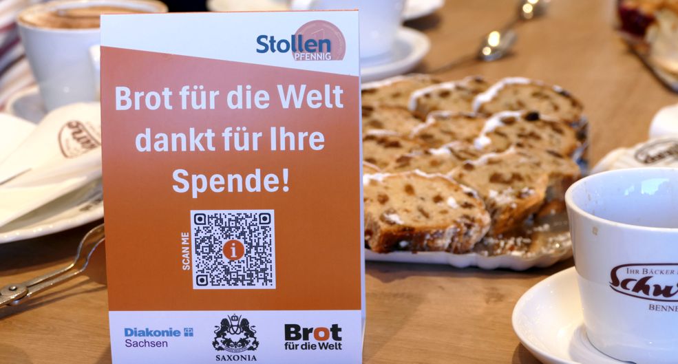 Tischaufsteller mit Werbung für die Aktion "Stollenpfennig"